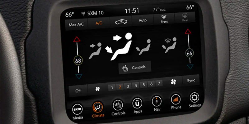 Digital car infotainment screen displaying climate control settings, showing air direction, fan speed, and temperature.